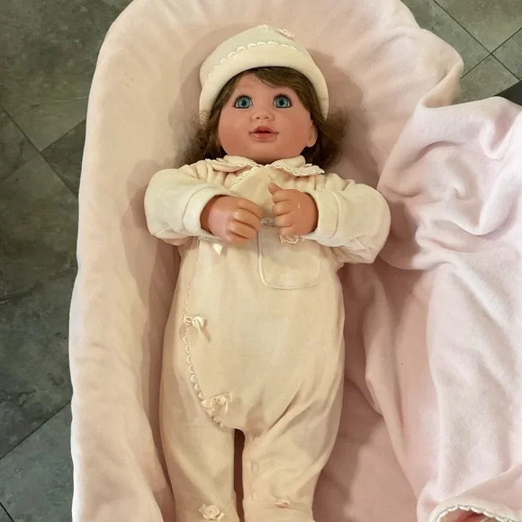 Adorable Baby Doll with Blue Eyes and Pink Outfit - Picture 3 of 7